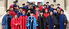 College faculty in regalia on the steps of Chapman's Reeves Hall