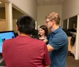 grad students in lab observation room