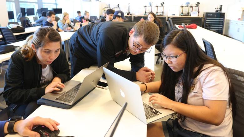 Chapman students working with their professor